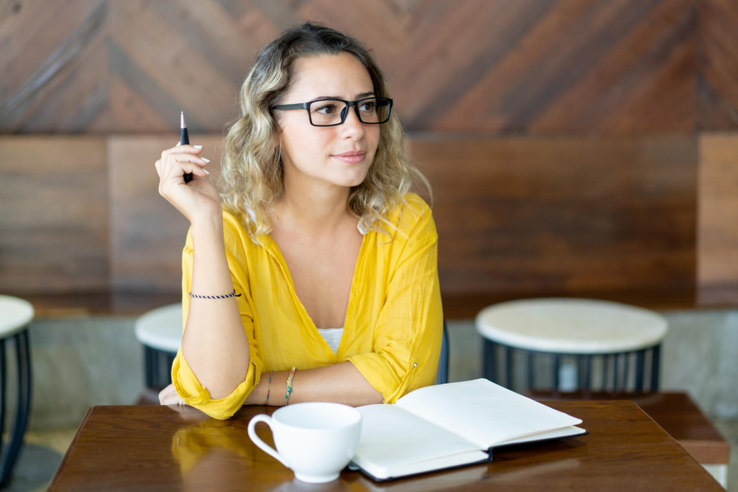 pretty-curly-young-woman-writing-notes-startup-project pretty-curly-young-woman-writing-notes-startup-project